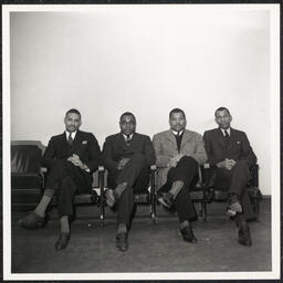 Four unidentified men posing at the Howard High School Awards Night in December 1938.