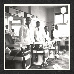 Burton's Tonsorial Parlor 801 Walnut St., four barbers, March, 1938