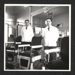 John Barber Shop, two barbers at their chairs, March 1939