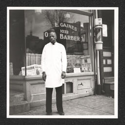 L.E. Gaines Barber Shop 1022 Walnut St. Gaines standing outside his shop, December 31, 1939