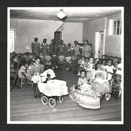 Garrett Settlement House 301 E. 7th St., children with teachers, June, 1939