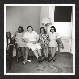 St. Michael's Day Nursery for Colored Children, four women pose on a sofa, 1940