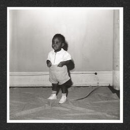 St. Michael's Day Nursery for Colored Children, a boy poses, 1940